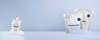White packaged personal care products on a pale blue background