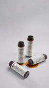Four small cylindrical ampoules arranged on a gray background