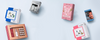 Kaaral haircare gift boxes and beauty kits arranged on a light blue background with open space in the center for banner content.