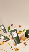 Illustrated green haircare products on a beige background