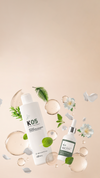 White and green K05 product arrangement on a beige background