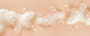 Foamy shampoo texture with translucent bubbles flowing across a soft peach background for banner content.