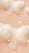 Foamy shampoo texture with translucent bubbles on a soft peach background, leaving open space in the center for banner content.