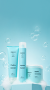 Three turquoise Purify Hydra hair products displayed with foam and bubbles