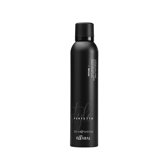 Tall black hair styling bottle on a black background