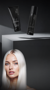 Woman with long straight platinum-blonde hair beneath two black Kaaral Perfetto hair care products