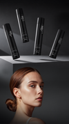 Woman with slicked-back brown hair beside four black Kaaral Perfetto hair styling products