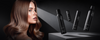 Brunette model beside a row of black haircare products