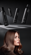 Brunette model below a row of black haircare bottles